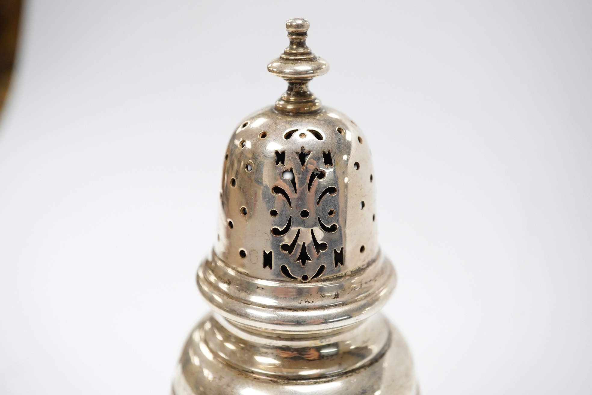 A George VI silver sugar caster, by William Comyns & Sons Ltd, London, 1936, 16.1cm, 5oz. Condition - fair